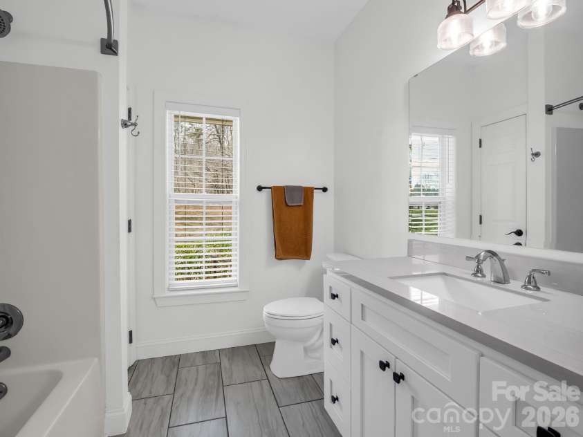 19 Lynnbrook Way, Columbus, NC 28722.  MLS# CAR4354890, YatesRealty ID 8710. Guest bathroom with tile flooring