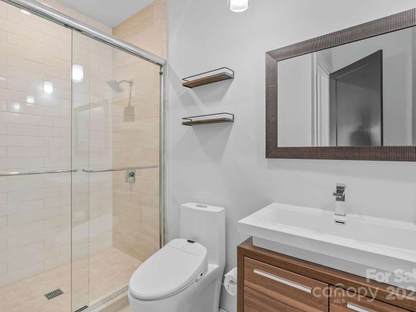 34 Grovepoint Way, Asheville, NC 28804.  MLS# CAR4228655, YatesRealty ID 8710. 2nd bath on main is separated by 8 foot sliding door for second primary area on main.
