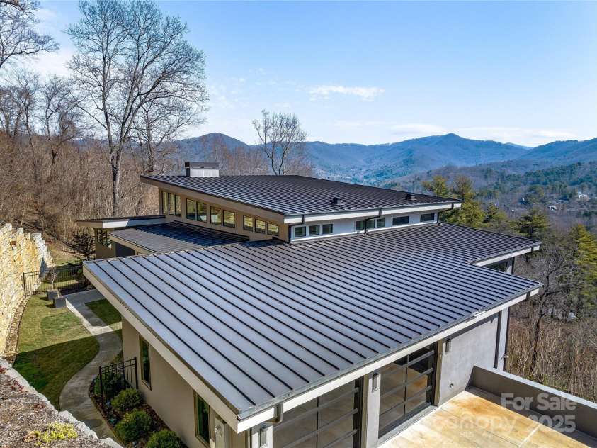 34 Grovepoint Way, Asheville, NC 28804.  MLS# CAR4228655, YatesRealty ID 8710. 50 year standing seam commercial grade roofing and gutter system.