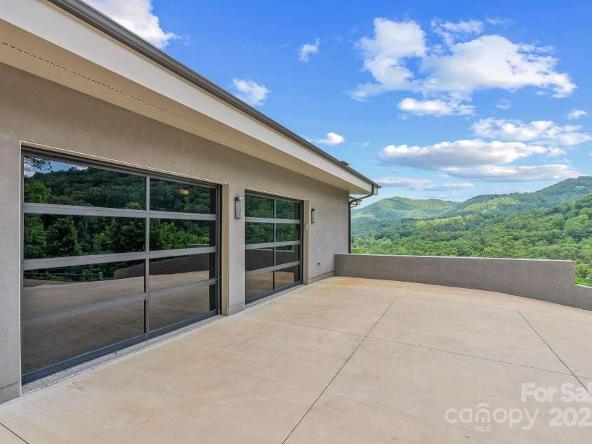 34 Grovepoint Way, Asheville, NC 28804.  MLS# CAR4228655, YatesRealty ID 8710. 50 year standing seam commercial grade roofing and gutter system.