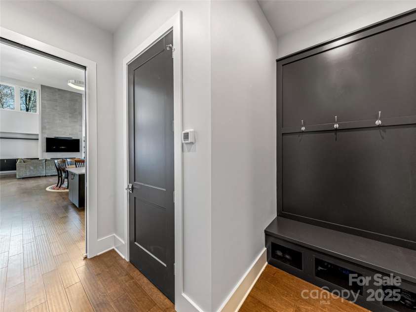 34 Grovepoint Way, Asheville, NC 28804.  MLS# CAR4228655, YatesRealty ID 8710. Entry Mudroom from Garage with Closet in line with closet below for elevator space.