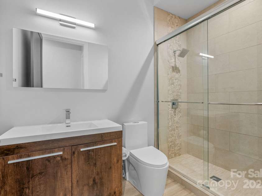 34 Grovepoint Way, Asheville, NC 28804.  MLS# CAR4228655, YatesRealty ID 8710. Lower level bathroom.