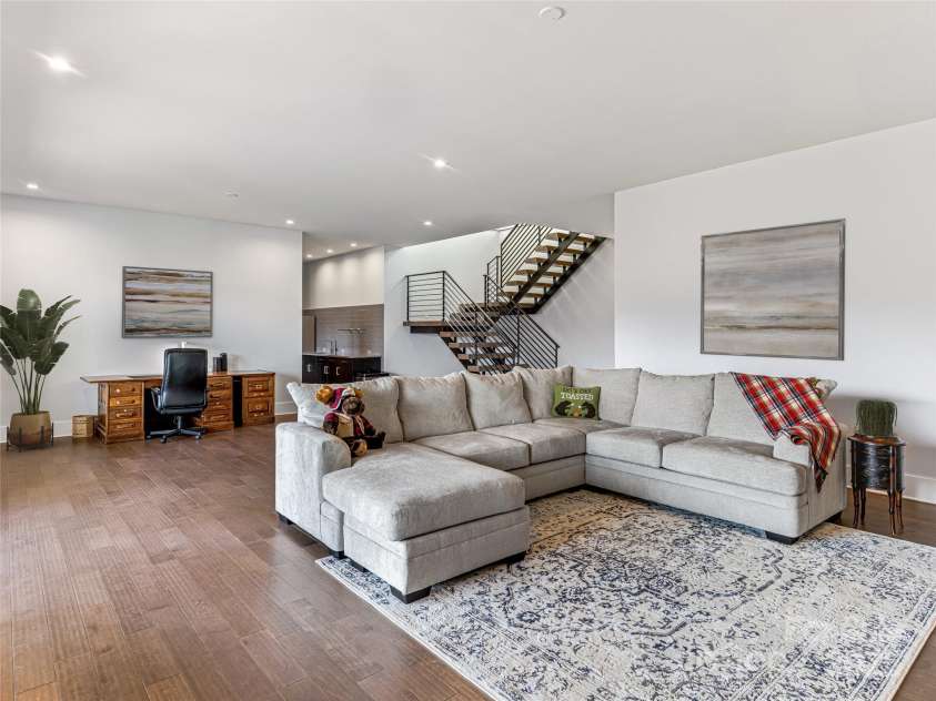 34 Grovepoint Way, Asheville, NC 28804.  MLS# CAR4228655, YatesRealty ID 8710. Lower level living room.