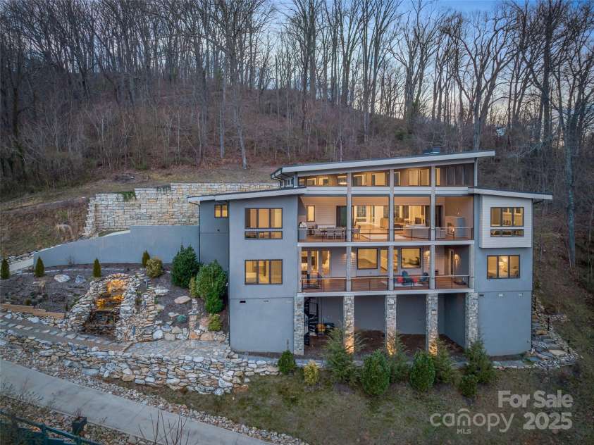34 Grovepoint Way, Asheville, NC 28804.  MLS# CAR4228655, YatesRealty ID 8710. Twilight evening view of home.