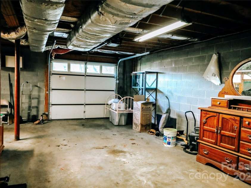 32 Windy Hollow Road, Asheville, NC 28806.  MLS# CAR4315574, YatesRealty ID 8712. Main level garage