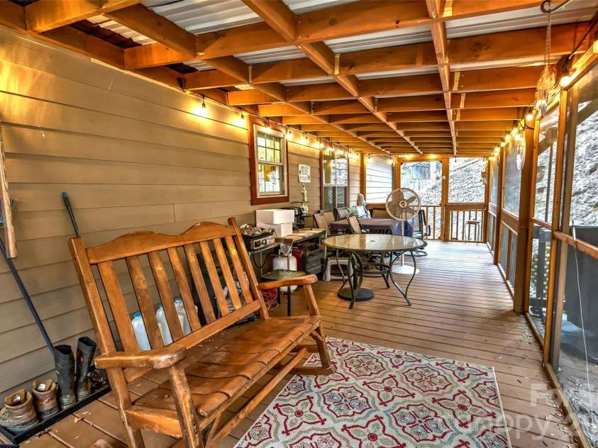 390 Camp Branch Road, Whittier, NC 28789.  MLS# CAR4344543, YatesRealty ID 8715. Back porch screened in