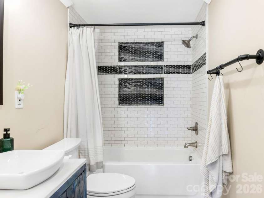 1105 Union Road, Matthews, NC 28104.  MLS# CAR4365721, YatesRealty ID 8718. Quality tile work and modern fixtures make getting ready a breeze.
