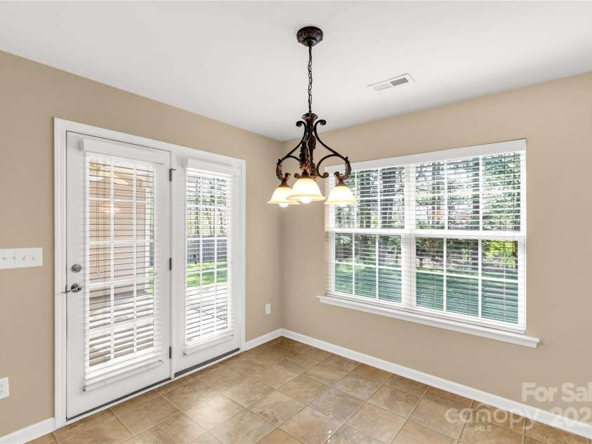 3411 Xandra Court, Indian Land, SC 29707.  MLS# CAR4242708, YatesRealty ID 8725. Kitchen dining area leads to back patio