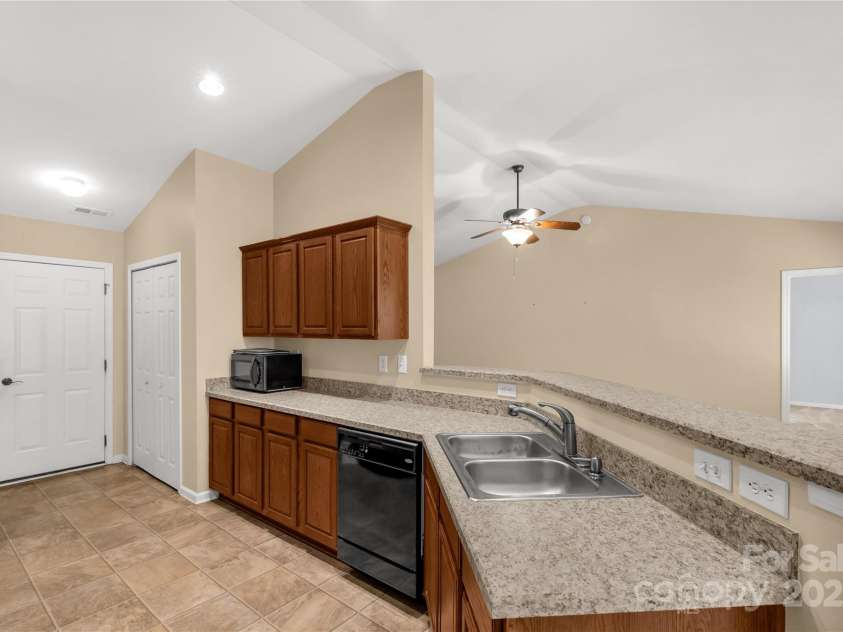 3411 Xandra Court, Indian Land, SC 29707.  MLS# CAR4242708, YatesRealty ID 8725. Kitchen overlooks great room perfect for entertaining or holidays