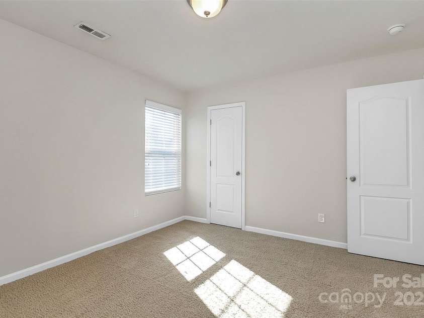 137 Woodbridge Circle, Mount Holly, NC 28120.  MLS# CAR4222548, YatesRealty ID 8731. Bedroom 3 with tons of natural light.