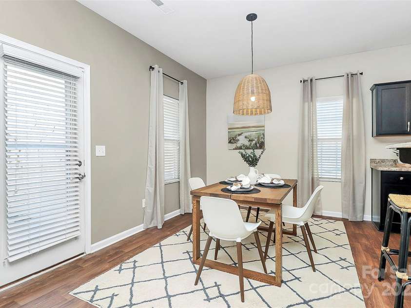 137 Woodbridge Circle, Mount Holly, NC 28120.  MLS# CAR4222548, YatesRealty ID 8731. Dining area leading to patio door for easy indoor/outdoor flow.