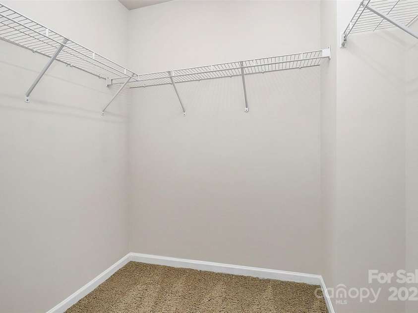137 Woodbridge Circle, Mount Holly, NC 28120.  MLS# CAR4222548, YatesRealty ID 8731. Huge primary walk-in closet.