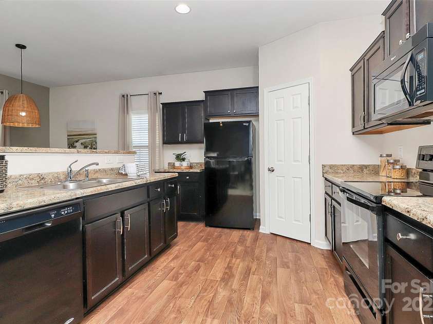 137 Woodbridge Circle, Mount Holly, NC 28120.  MLS# CAR4222548, YatesRealty ID 8731. Kitchen view 1 - spacious pantry; refrigerator conveys!