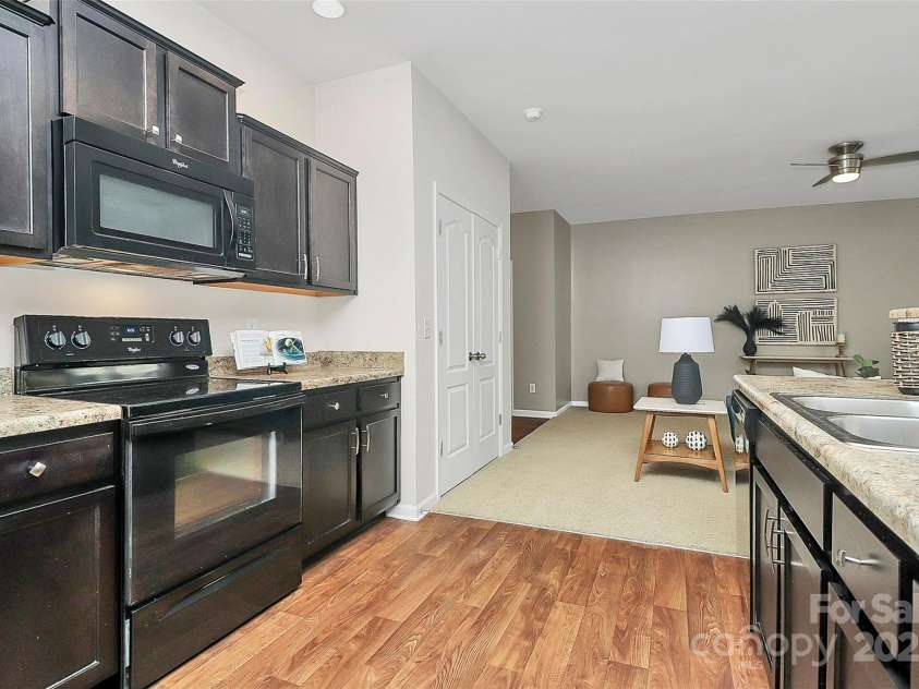 137 Woodbridge Circle, Mount Holly, NC 28120.  MLS# CAR4222548, YatesRealty ID 8731. Open dining/kitchen area with transition bar suitable for plenty of guests.