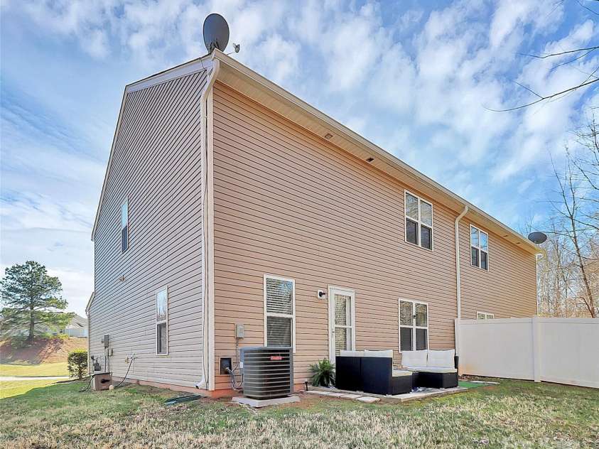 137 Woodbridge Circle, Mount Holly, NC 28120.  MLS# CAR4222548, YatesRealty ID 8731. Spacious, private, END-UNIT backing up to woods. 137 Woodbridge Circle has it all.