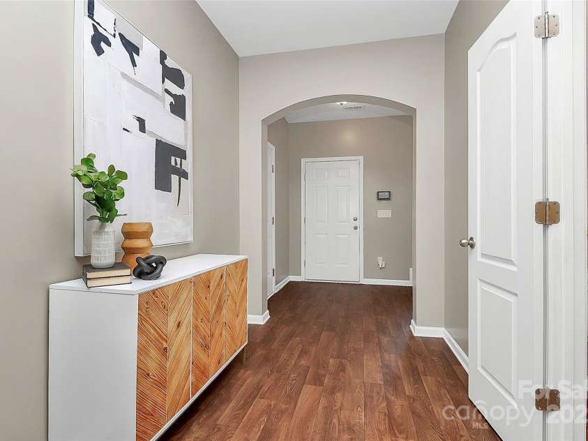 137 Woodbridge Circle, Mount Holly, NC 28120.  MLS# CAR4222548, YatesRealty ID 8731. View to foyer area showing garage door to the left and powder room door to the right.
