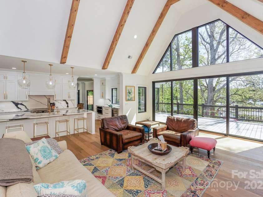 153 High Hills Drive, Mooresville, NC 28117.  MLS# CAR4246842, YatesRealty ID 8735. Open floorplan w/Vaulted Great Room and 4 sliding doors to the upper deck