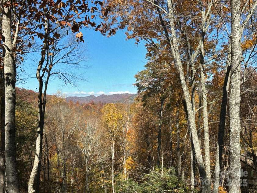 126 Mossycup Court, Tuckasegee, NC 28783.  MLS# CAR4324867, YatesRealty ID 874. Fall Views from the Deck