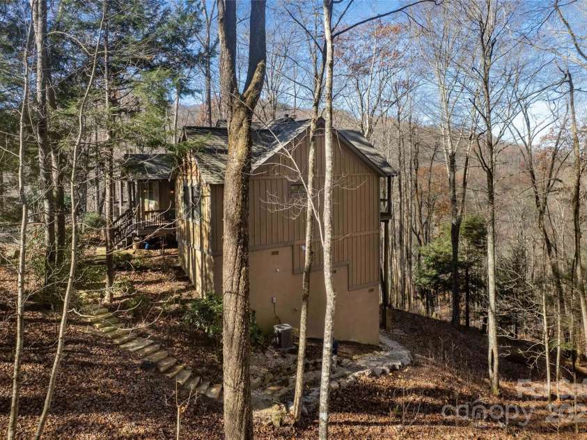 126 Mossycup Court, Tuckasegee, NC 28783.  MLS# CAR4324867, YatesRealty ID 874. Right Elevation and new stone steps to the rear of the house