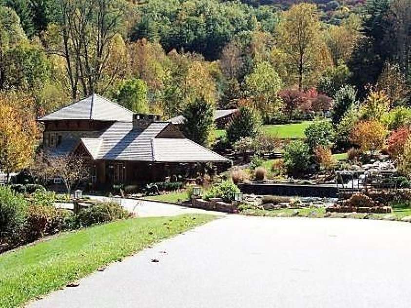 126 Mossycup Court, Tuckasegee, NC 28783.  MLS# CAR4324867, YatesRealty ID 874. Waterfall Entrance - Greeter's Cottage. 