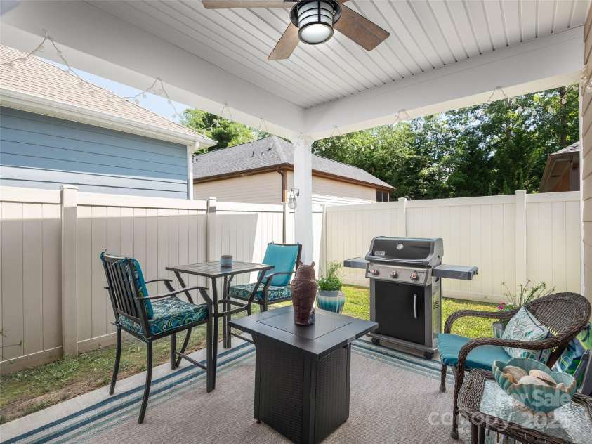 602 Summerfield Place, Flat Rock, NC 28731.  MLS# CAR4276322, YatesRealty ID 8744. Covered Patio with Privacy Fence