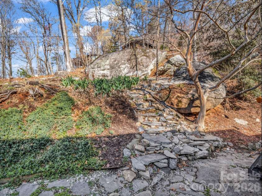 456 Youngs Mountain Drive, Lake Lure, NC 28746.  MLS# CAR4356097, YatesRealty ID 8748. Dry Water Fall cascade