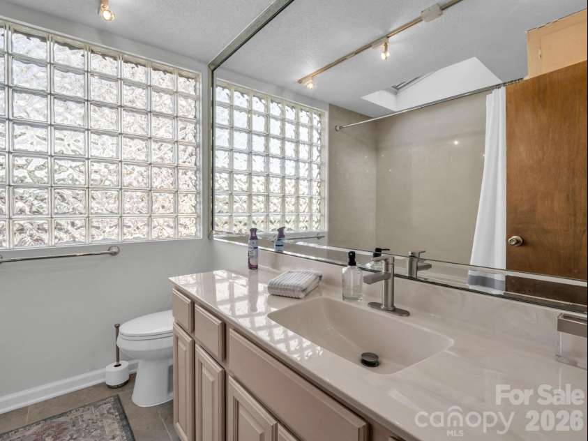 456 Youngs Mountain Drive, Lake Lure, NC 28746.  MLS# CAR4356097, YatesRealty ID 8748. Hall Bathroom