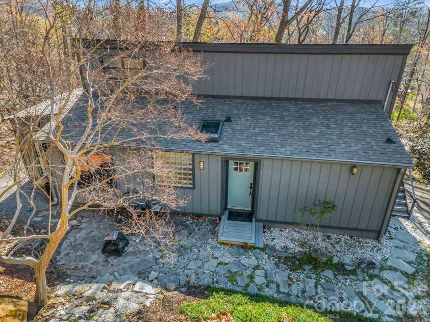 456 Youngs Mountain Drive, Lake Lure, NC 28746.  MLS# CAR4356097, YatesRealty ID 8748. Relaxing fire pit on a rock patio