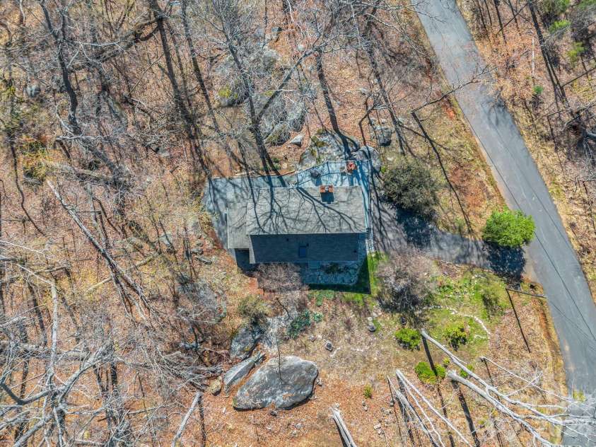 456 Youngs Mountain Drive, Lake Lure, NC 28746.  MLS# CAR4356097, YatesRealty ID 8748. Stone Fireplace