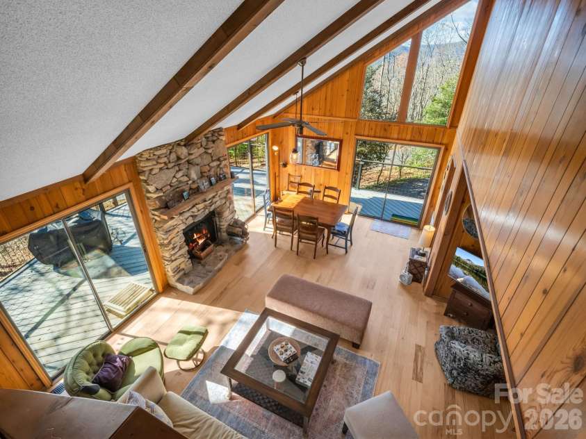 456 Youngs Mountain Drive, Lake Lure, NC 28746.  MLS# CAR4356097, YatesRealty ID 8748. View from Loft overlooking living/dining