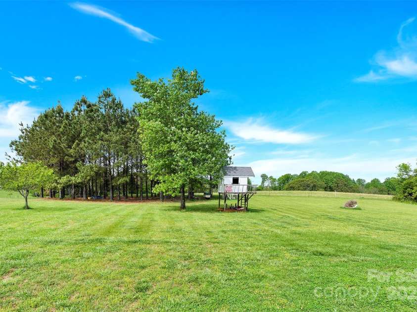 365 Kinder Road, Harmony, NC 28634.  MLS# CAR4243617, YatesRealty ID 8755. Back Yard with Treehouse