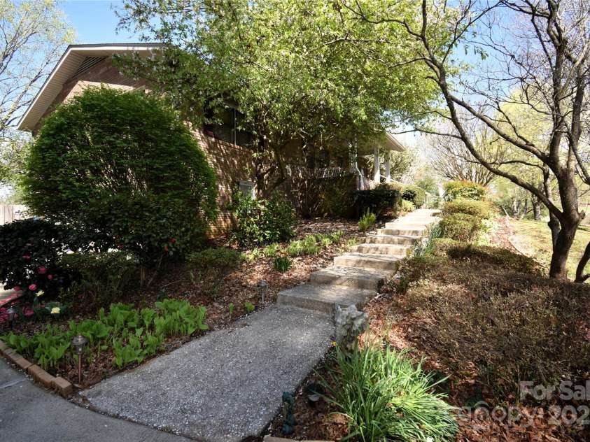 37 Hillside Drive, Etowah, NC 28729.  MLS# CAR4243156, YatesRealty ID 8761. Concrete walkway to front door