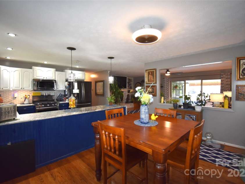 37 Hillside Drive, Etowah, NC 28729.  MLS# CAR4243156, YatesRealty ID 8761. Dining room looking to living room