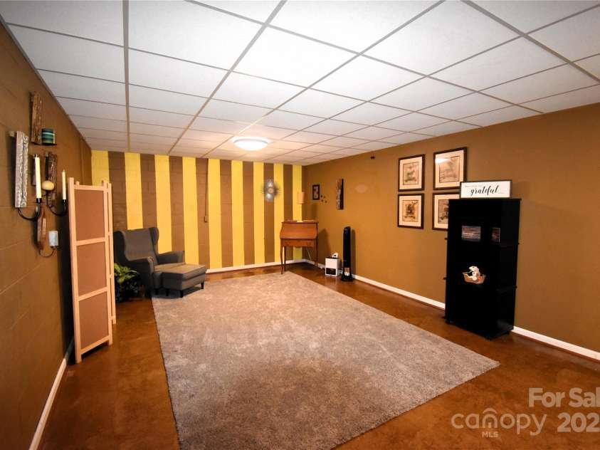 37 Hillside Drive, Etowah, NC 28729.  MLS# CAR4243156, YatesRealty ID 8761. Finished room in basement