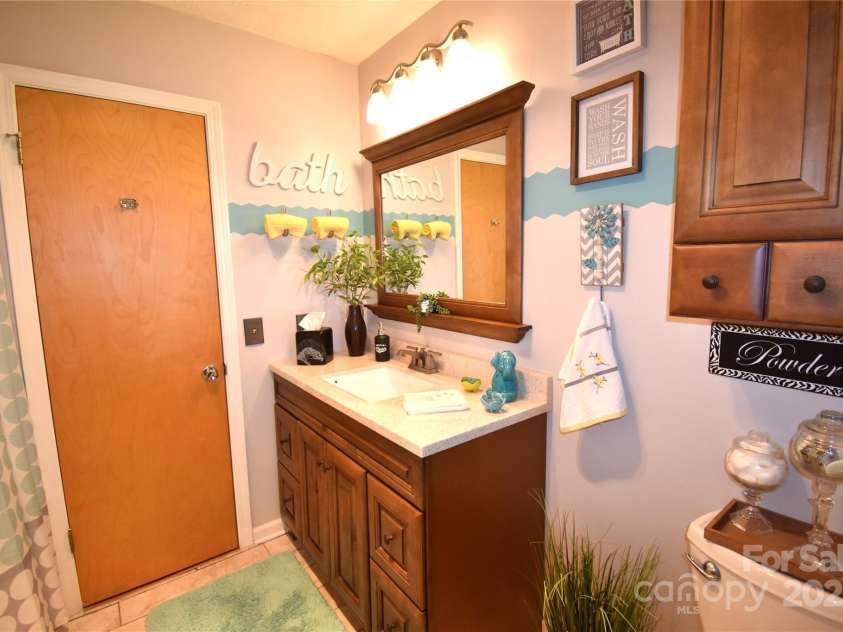 37 Hillside Drive, Etowah, NC 28729.  MLS# CAR4243156, YatesRealty ID 8761. Hall bathroom
