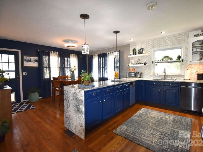 37 Hillside Drive, Etowah, NC 28729.  MLS# CAR4243156, YatesRealty ID 8761. Kitchen to dining room