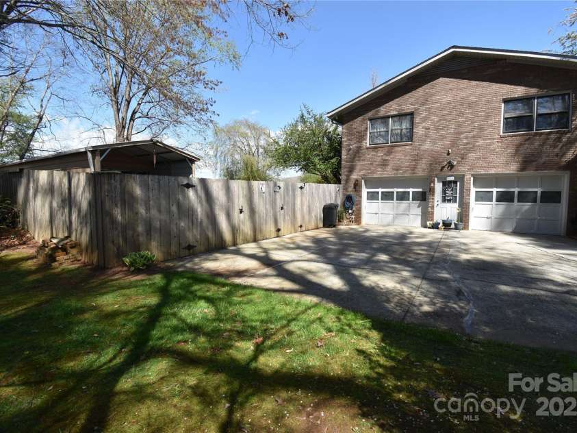 37 Hillside Drive, Etowah, NC 28729.  MLS# CAR4243156, YatesRealty ID 8761. Workshop behind fenced yard