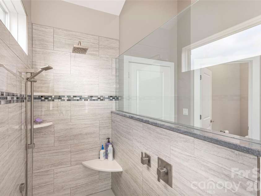 930 Big Raven Lane, Saluda, NC 28773.  MLS# CAR4270163, YatesRealty ID 8761. A beautifully tiled ADA certified shower