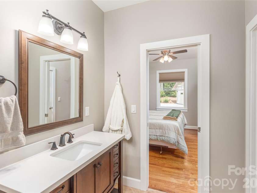 930 Big Raven Lane, Saluda, NC 28773.  MLS# CAR4270163, YatesRealty ID 8761. A jack and jill, full bath with shower, connects the 2 bedrooms