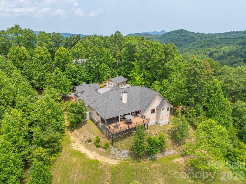 930 Big Raven Lane, Saluda, NC 28773.  MLS# CAR4270163, YatesRealty ID 8761. A private estate and retreat in the Saluda mountains yet easily accessible to Hendersonville and Asheville. 