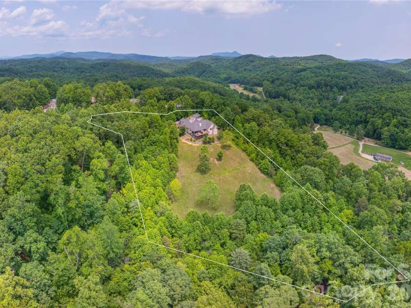 930 Big Raven Lane, Saluda, NC 28773.  MLS# CAR4270163, YatesRealty ID 8761. An aerial view of the 6.79 acre property, providing so much privacy and nature.