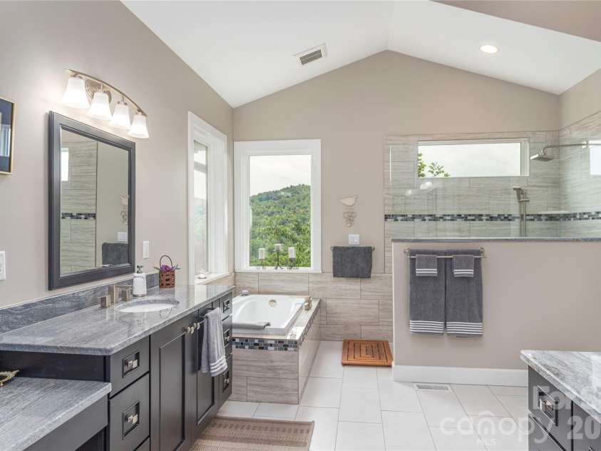 930 Big Raven Lane, Saluda, NC 28773.  MLS# CAR4270163, YatesRealty ID 8761. Enjoy more views from the jacuzzi tub