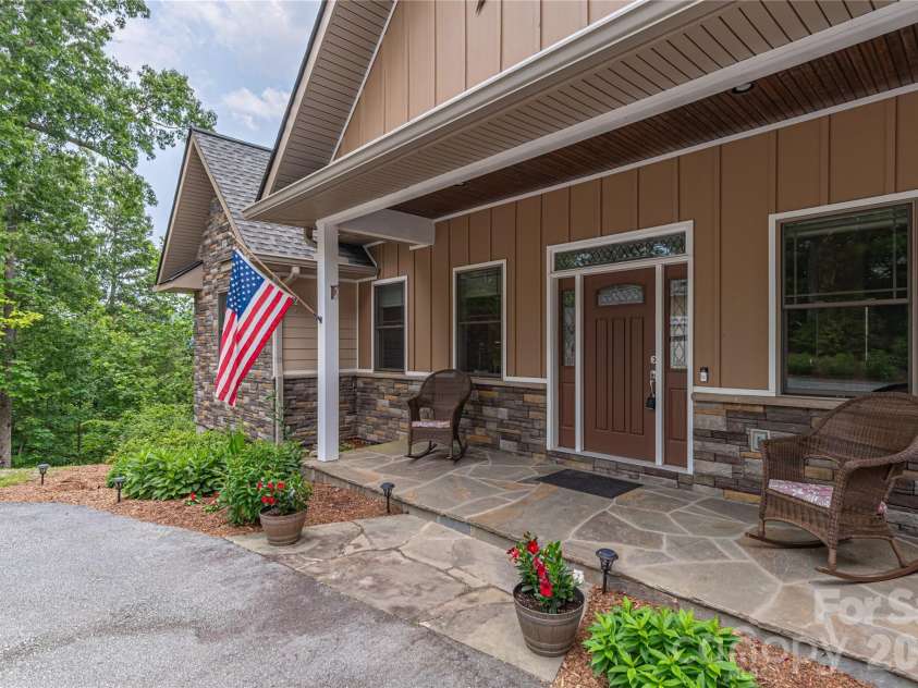 930 Big Raven Lane, Saluda, NC 28773.  MLS# CAR4270163, YatesRealty ID 8761. Front patio made from natural flagstone