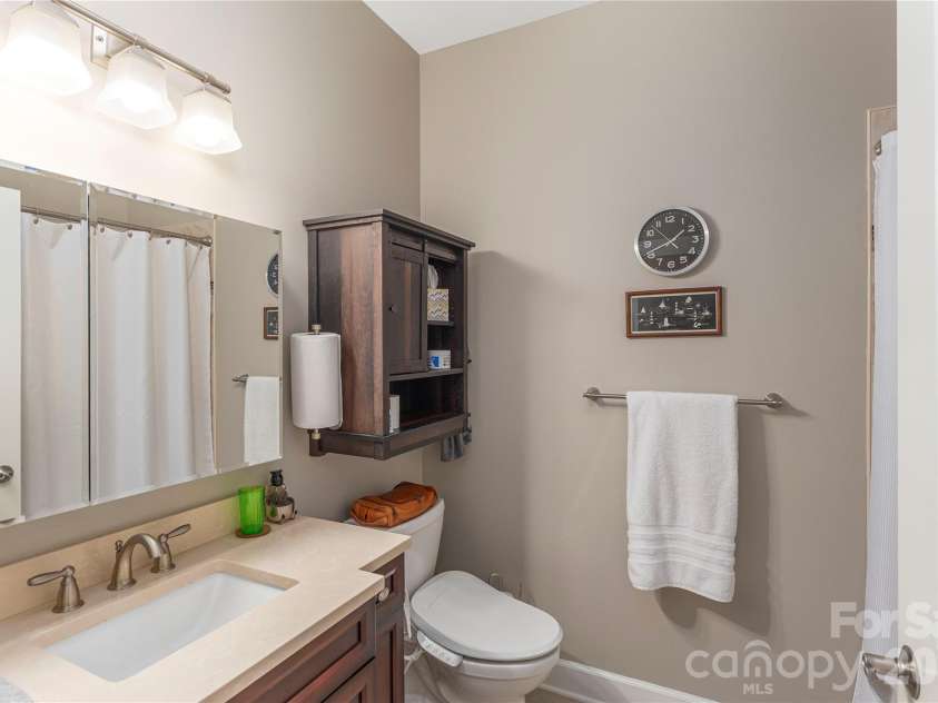 930 Big Raven Lane, Saluda, NC 28773.  MLS# CAR4270163, YatesRealty ID 8761. Half bath for guests just off the 2 car garage