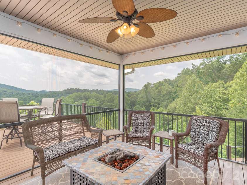 930 Big Raven Lane, Saluda, NC 28773.  MLS# CAR4270163, YatesRealty ID 8761. Imagine yourself watching the big game, right here on your cozy screened in back porch with all of the outlets for a tv and surround sound.