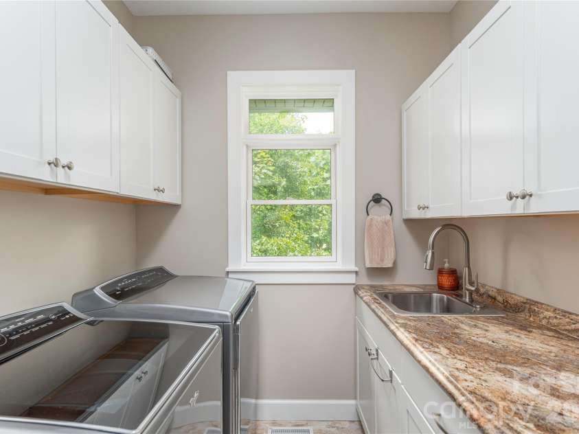 930 Big Raven Lane, Saluda, NC 28773.  MLS# CAR4270163, YatesRealty ID 8761. Main level living with a convenient laundry room