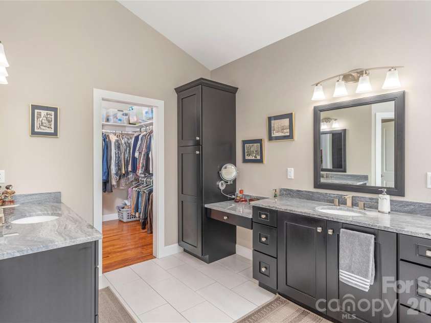 930 Big Raven Lane, Saluda, NC 28773.  MLS# CAR4270163, YatesRealty ID 8761. Primary bathroom offers 2 separate vanities