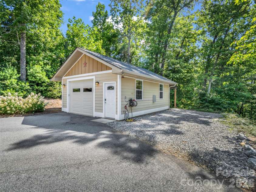 930 Big Raven Lane, Saluda, NC 28773.  MLS# CAR4405808, YatesRealty ID 8761. Detached garage with RV hookups & spot for RV
