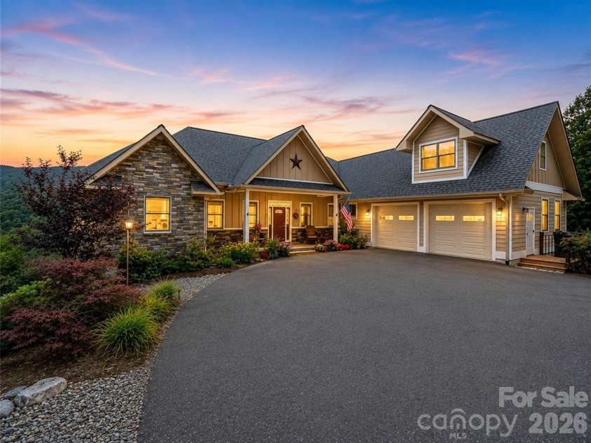 930 Big Raven Lane, Saluda, NC 28773.  MLS# CAR4405808, YatesRealty ID 8761. Front of house in evening!