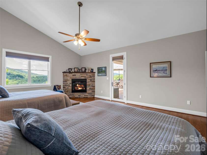 930 Big Raven Lane, Saluda, NC 28773.  MLS# CAR4405808, YatesRealty ID 8761. Primary Bedroom fireplace